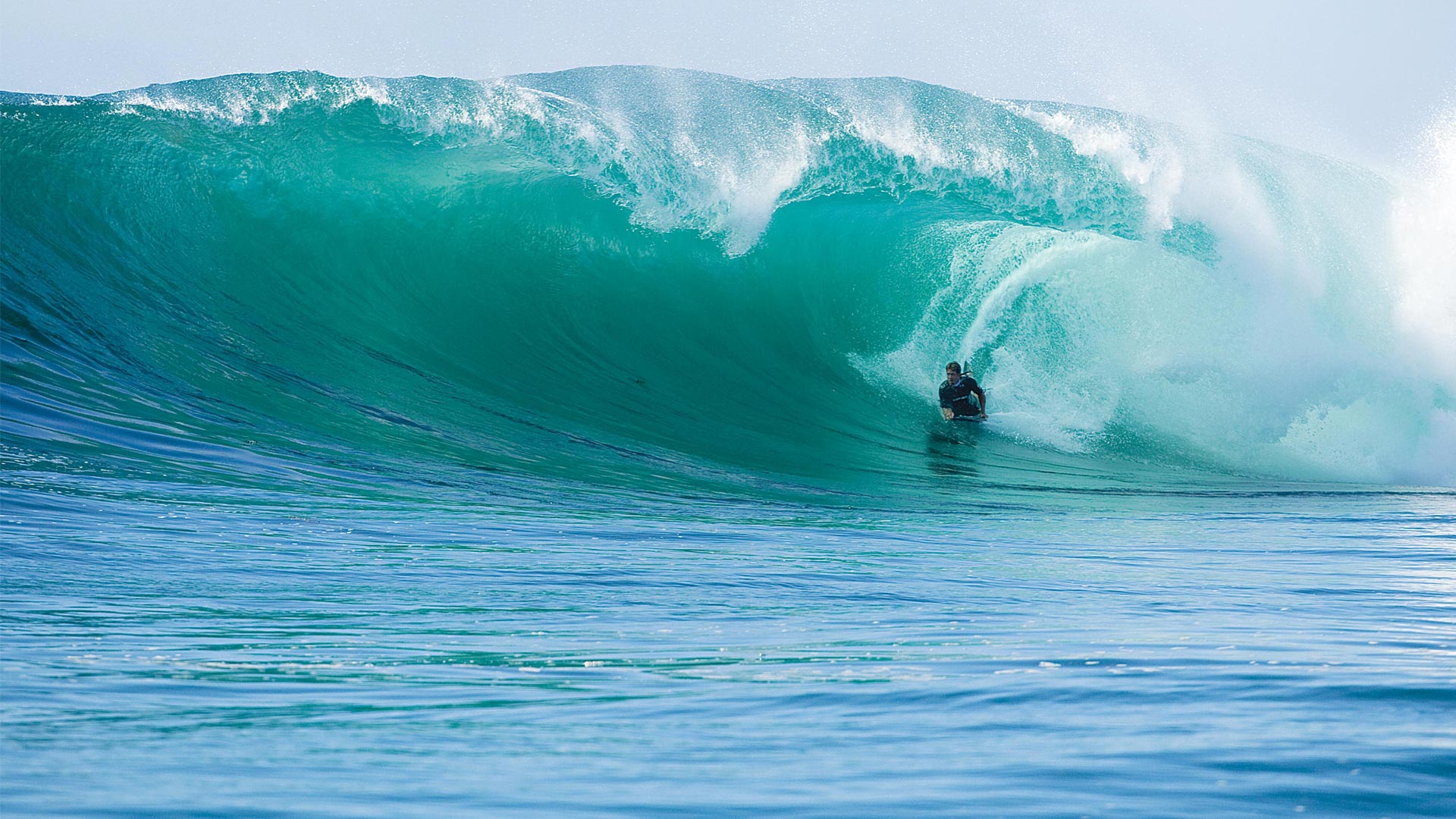 Bodyboarder riding POD PF2 Swim Fins and Bicep Leash
