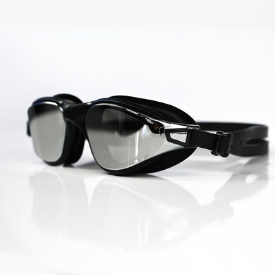 Black Max swim goggles with a reflective silver mirror lens, shown on a clean white reflective surface.