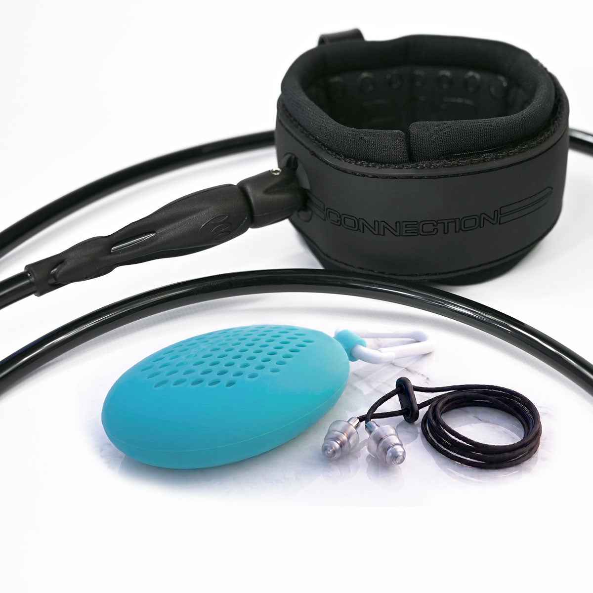 A POD Connection 6ft surfboard leash with coiled cord and ankle cuff, displayed with a pair of Pro EarSeal surfers earplugs on a cord and a teal silicone earplug carry case