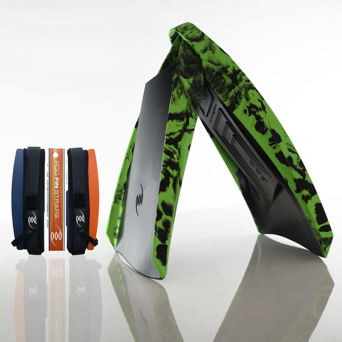 A pair of green and black variegated POD PF3 swim fins standing upright alongside navy and orange POD fin straps in their packaging, displayed on a reflective surface