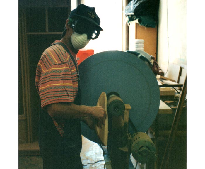 Shane Shaping a Pod Handboard on the Drum Sander